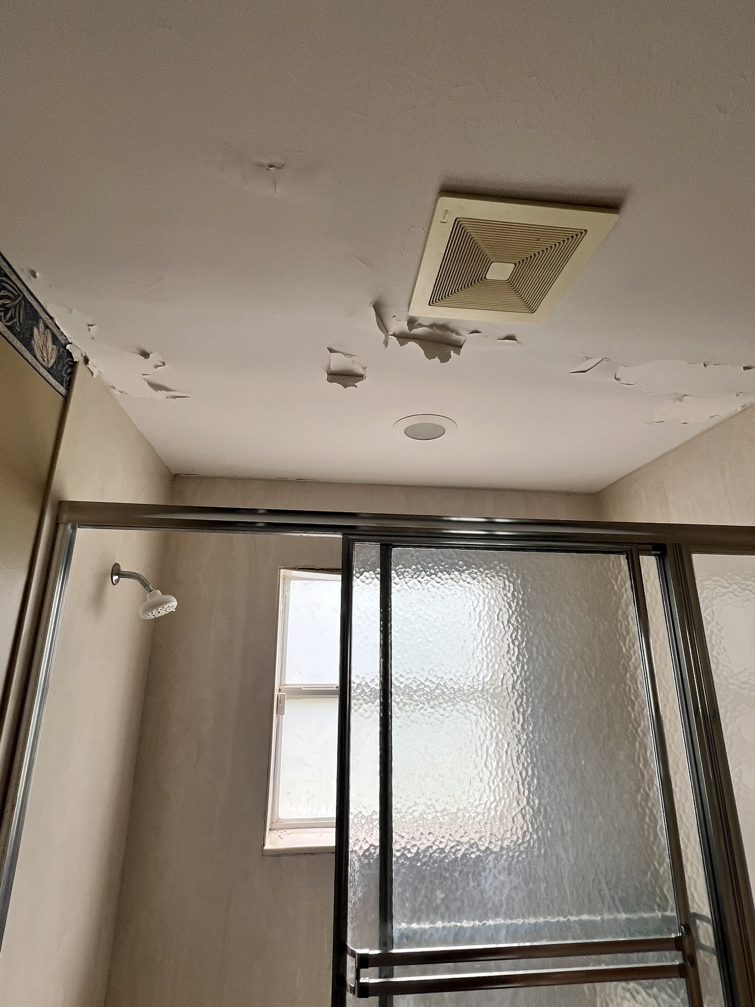 Ceiling peeling before guest bath remodel