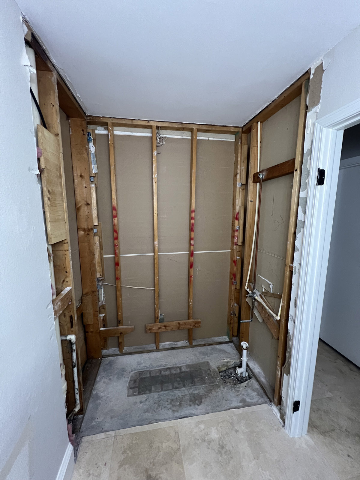 Existing cast iron tub and wall tile were removed down to the studs