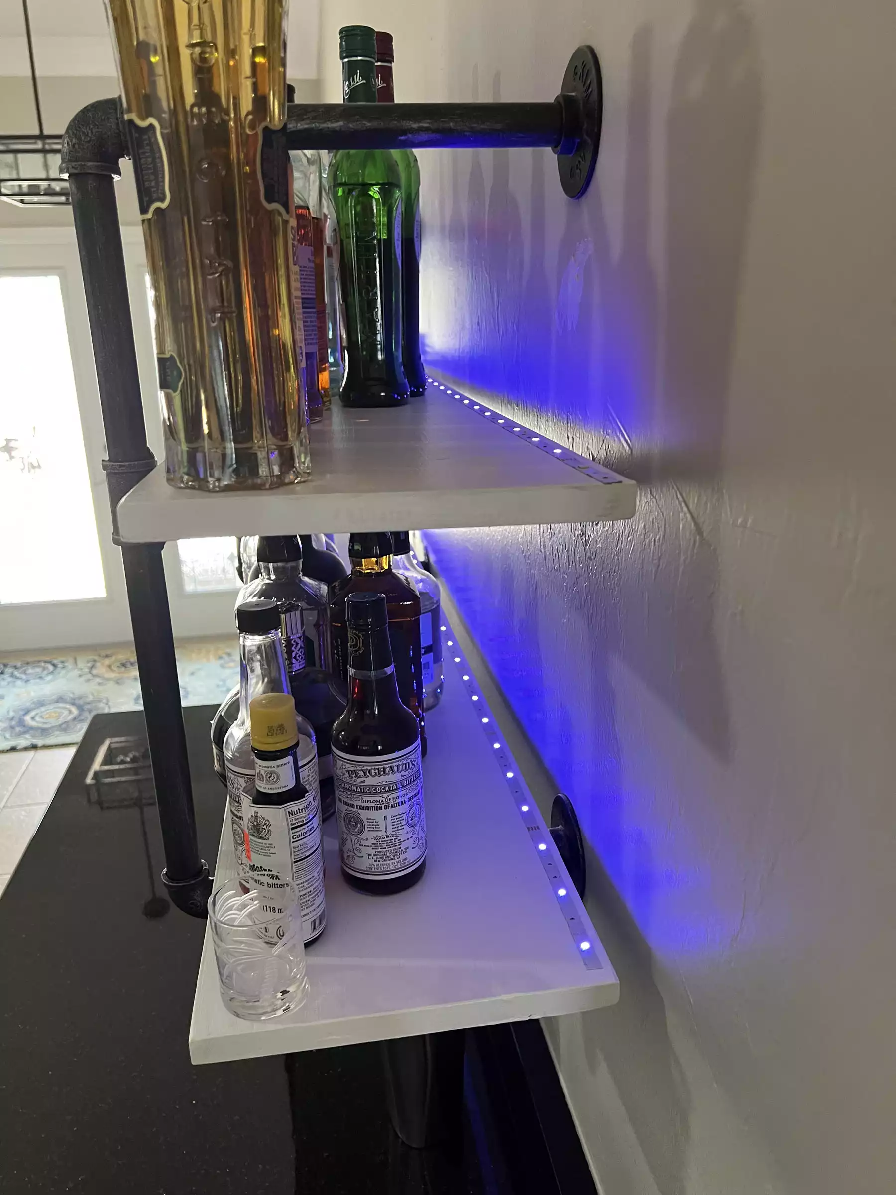 Custom liquor shelving with hidden LED lighting