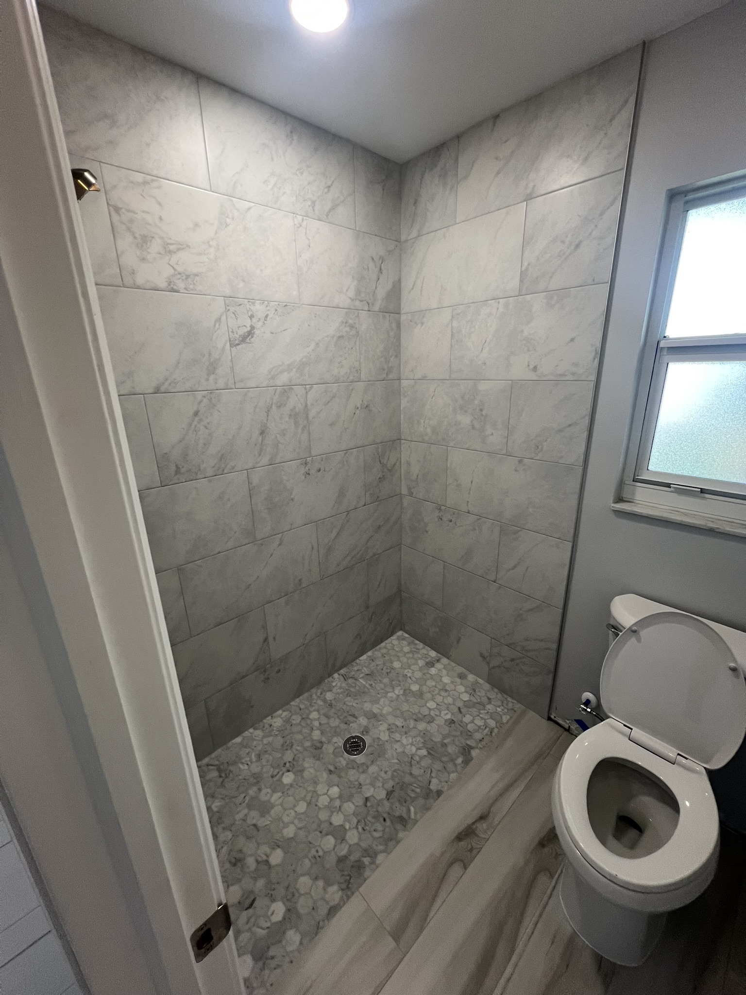 Master Bath zero-entry shower, improving both accessibility and contemporary appeal