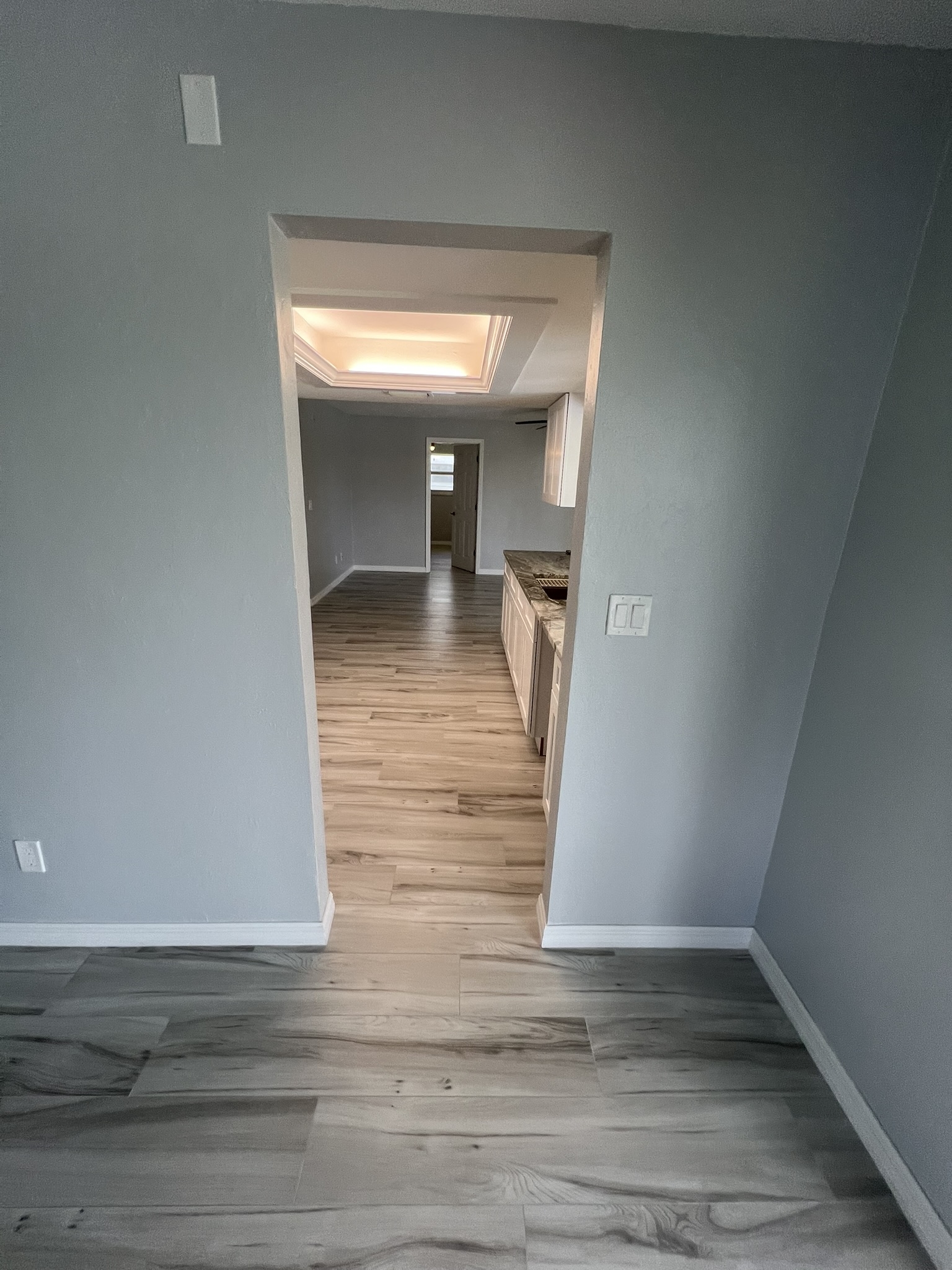 New wood-look ceramic tiles throughout