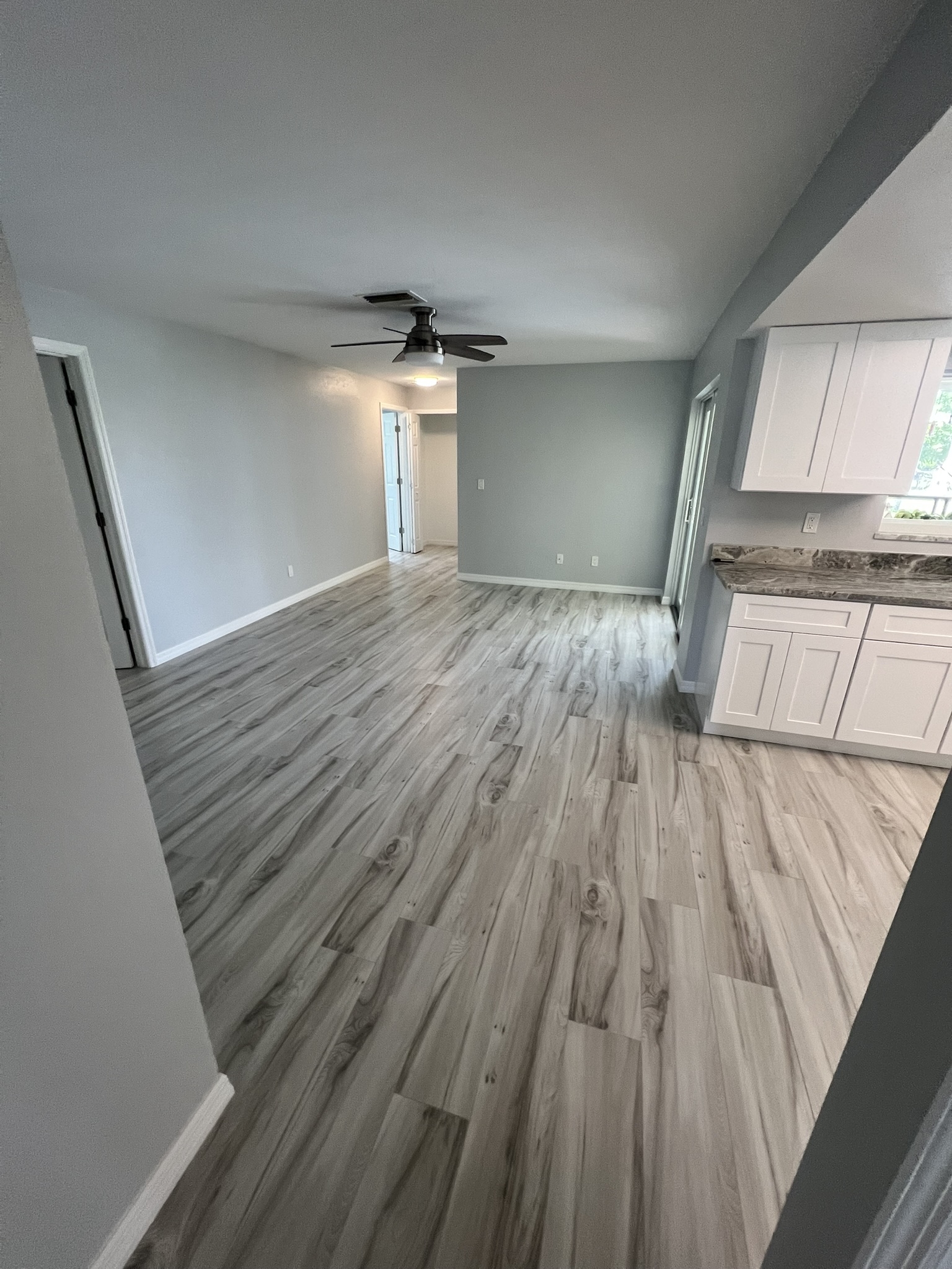 Damaged drywall was cut out and replaced. The entire interior received fresh sheetrock repairs and a full repainting for a clean, renewed appearance