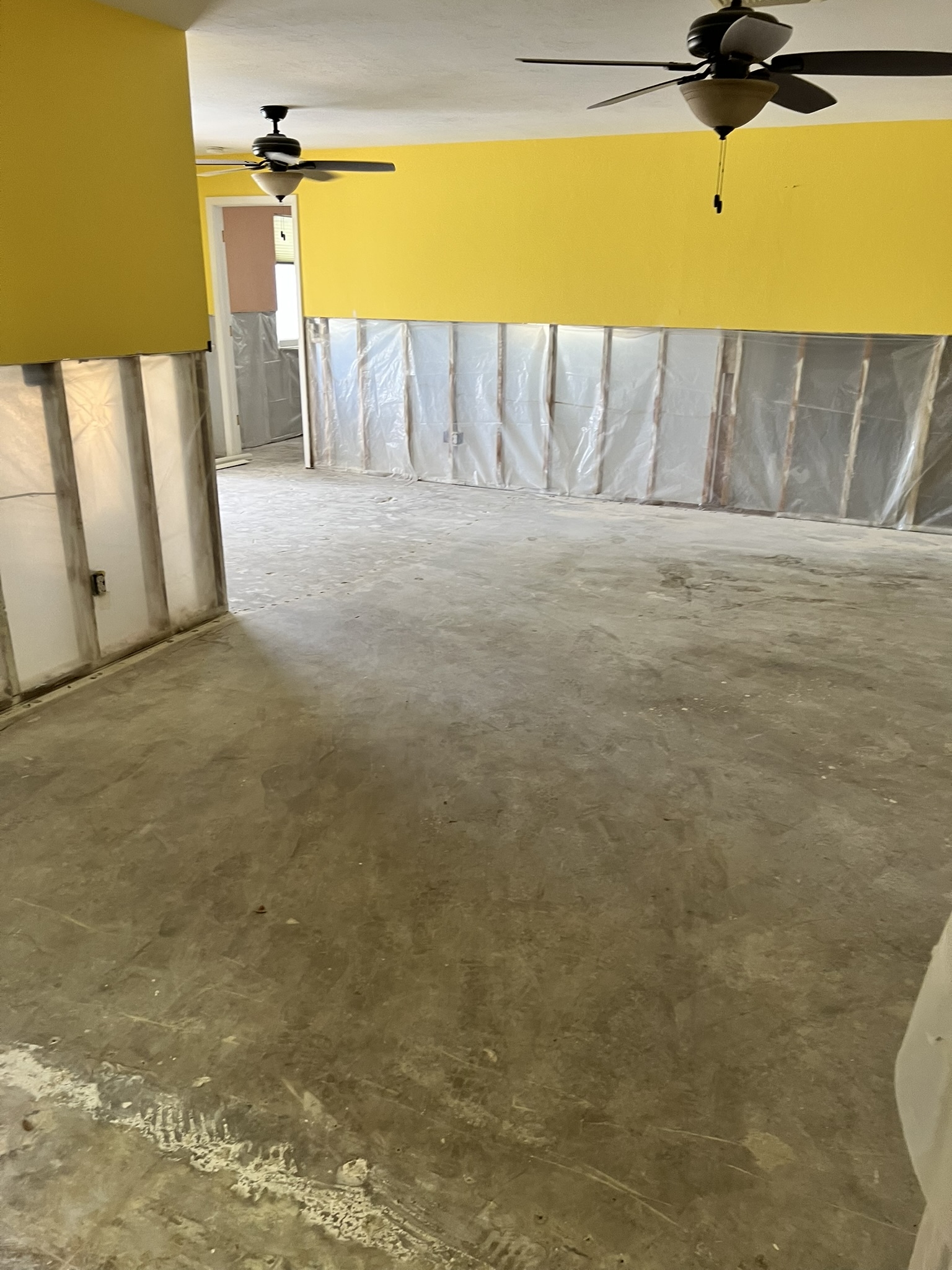 Removal of all existing flooring, down to the bare concrete