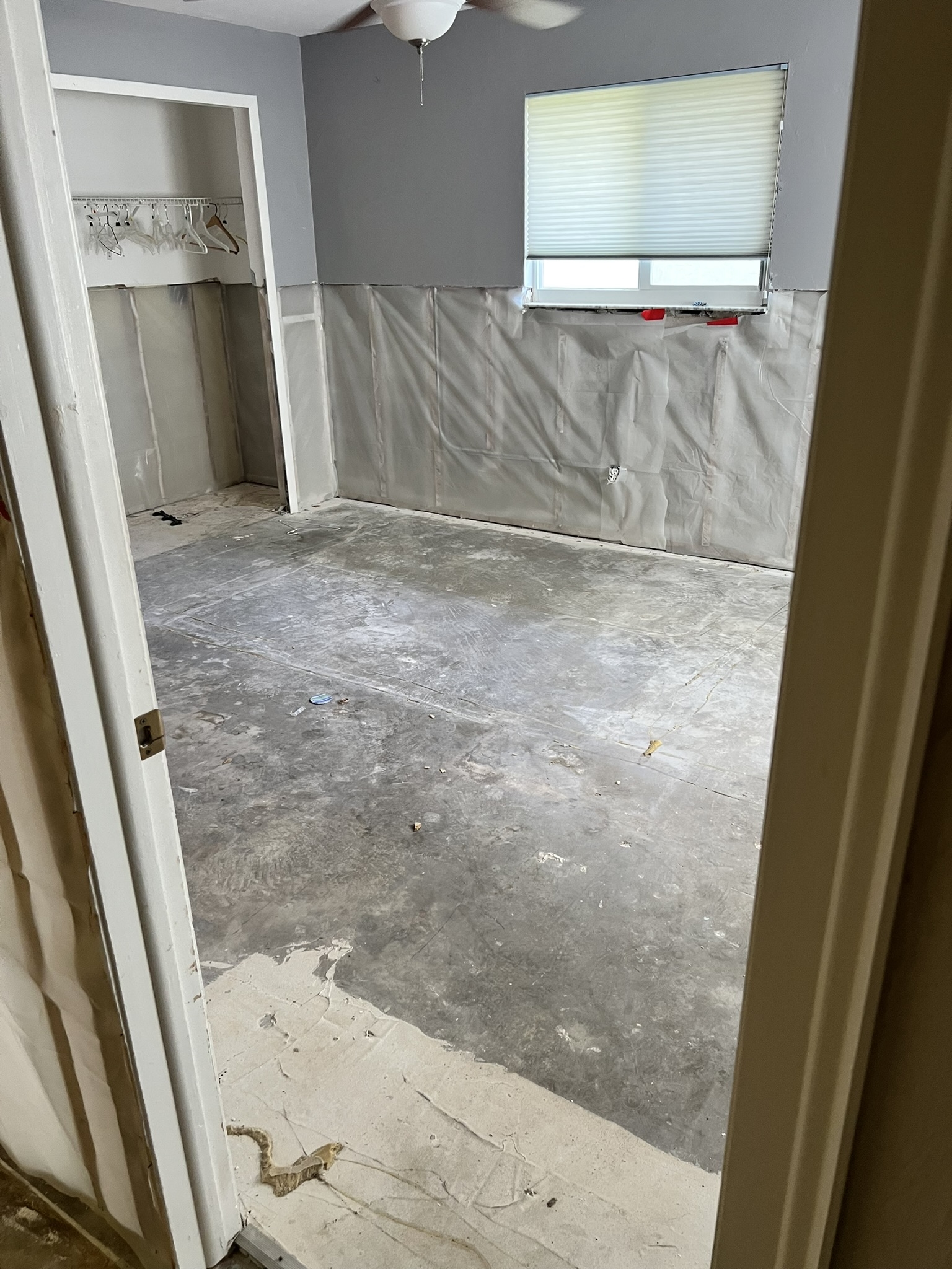 Bedroom demo of interior walls to four feet high and all existing flooring