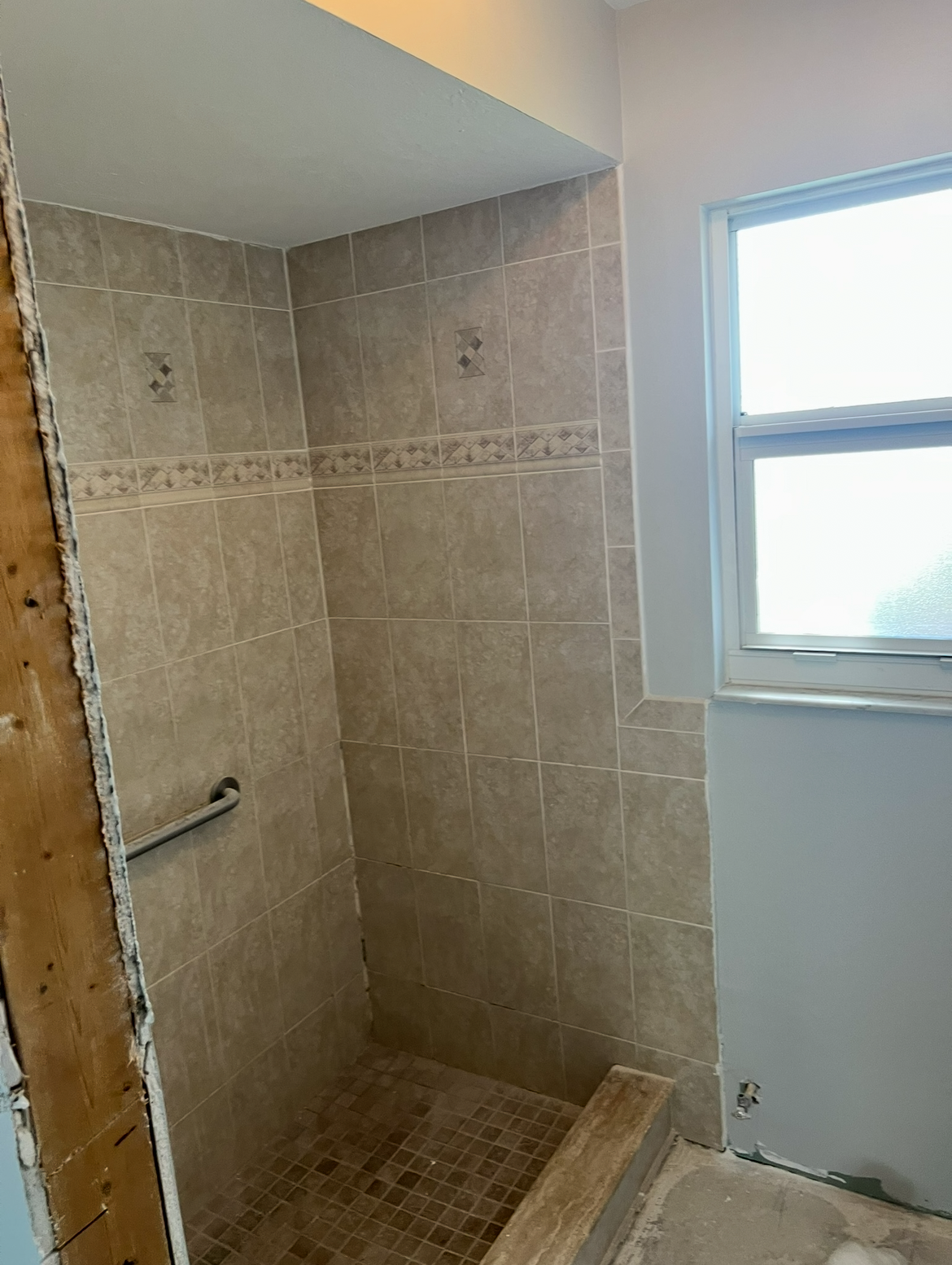 Master bath shower with curb entry before remodel
